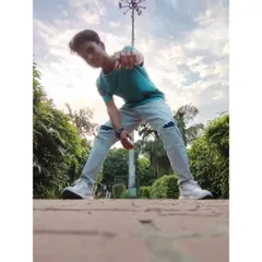 A low angle shot that captures the feeling of reaching for your goals. My poetry and my dance both come from a place of ambition and self-discovery.