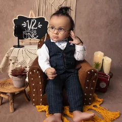 This little gentleman is looking so dapper with his tiny glasses and serious expression. The 'halfway to one' milestone is a perfect time to capture their unique personality.