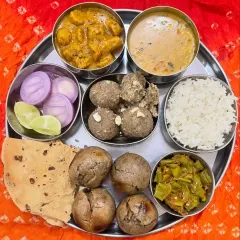 The heart of our service is the authentic Rajasthani Thali. This plate features our signature Dal, Bati, and Churma, made with traditional recipes and pure ingredients for a taste of true Rajasthani heritage.