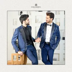 A beautifully framed shot of two blue tuxedo styles, perfect for clients looking for coordinated yet individual looks for a wedding party or formal event.