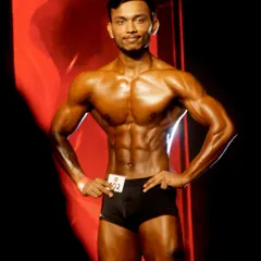My client competing as a men's fitness model at ICN Bangalore 2024. His balanced, aesthetic physique is exactly what the judges look for in this category.