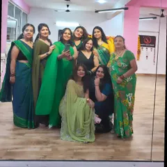A mirror selfie with my girls during our Teej celebration. The large mirror is perfect for group photos.