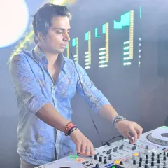 In the act at a white party, completely focused on the mix. This is a classic shot of me at work, crafting the perfect sound for the night.