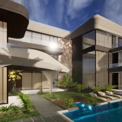 This angle highlights the interplay of different materials and forms in a modern Indian home. The design incorporates textured feature walls, cantilevered balconies, and a seamless connection to the outdoor pool area, embodying contemporary luxury.
