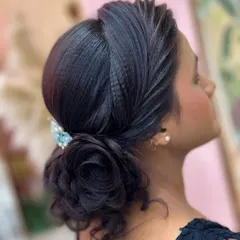 A beautiful and elegant rose bun hairstyle, perfect for receptions or parties. This was created as a demonstration for my students to practice.