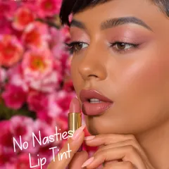 This is the result of makeup that truly cares for your skin. My 'No Nasties' lip tint gives you a beautiful, natural finish, seen here against a backdrop of fresh flowers that inspire our organic color palette.