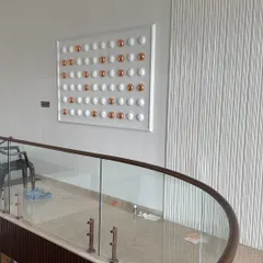 Another shot of the finished relief art, showing its placement in the context of the curved staircase. The piece was designed to be a point of interest as you move between floors, adding a touch of custom elegance.