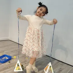 A proud smile and a handmade creation. This is the result of our crafting sessions, where children learn to follow steps, use their hands, and feel a sense of accomplishment.
