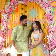 A candid, romantic shot of the couple gazing at each other during their Mehendi function.