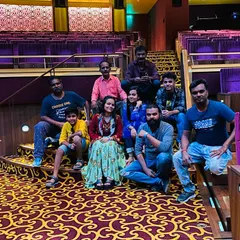 Our team taking a moment to rest in the beautiful theatre at NMACC after setting up the lights and sound. A lot of work goes on behind the scenes to make the show perfect.