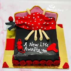 A cheeky cake for a bride or groom-to-be. This bed-themed cake comes with a playful message, 'A New Life Awaits You', perfect for a bachelorette or bachelor party.