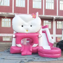 This is our Hello Kitty bouncy castle, complete with a small slide and a ball pool area. The bright pink and white design is very popular for little kids' parties.