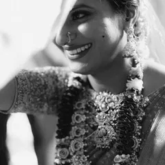 A beautiful black and white close-up of the bride, Sravanthi, her smile radiant during the ceremony.