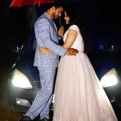 A light blue checkered suit provides a modern and stylish look for the groom to be in this romantic nighttime pre-wedding photo.