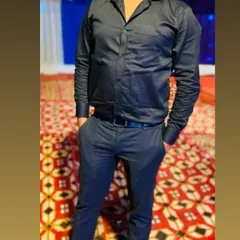A client dressed in a black formal shirt and trousers I tailored for him. A monochromatic look like this is always sharp and stylish for an evening event.