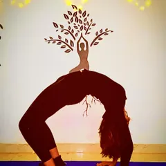 The Wheel Pose (Chakrasana) is a powerful heart-opener that strengthens the spine, arms, and legs. This image captures the full expression of the pose, showcasing the flexibility and strength that a consistent practice can build.