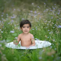 We can even take our milk bath sessions outdoors. This portrait, taken in a field of wildflowers, has a wonderfully natural and serene feel.