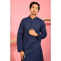 A closer look at the navy blue festive kurta. The mandarin collar and detailed placket demonstrate the careful tailoring that goes into each piece, ensuring a perfect fit and a sharp appearance.