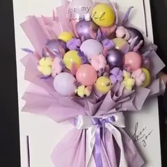 Why give a card when you can give a bouquet card? This unique creation mounts a pastel-colored balloon bouquet onto a large card, which can be personalized with a handwritten message.