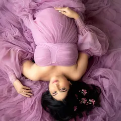 Your maternity session is a chance to feel like a queen. This artistic top-down portrait shows how we can play with perspective and colour, using one of the many glamorous gowns available in my studio wardrobe to create something truly unique.