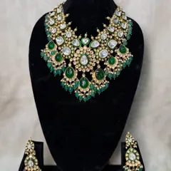 My green bilandi set B-12 is a heavier option in a beautiful pastel shade. The full, cascading design makes it a statement piece for any bride.