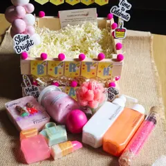 A fun and festive birthday hamper. This wooden crate is decorated for a celebration and filled with a variety of my handmade soaps, lotions, and bath products.