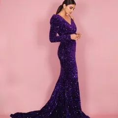 A side-profile shot of Daisy Shah, highlighting the elegant silhouette of the gown and creating a sophisticated, editorial feel.