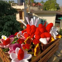 A crate of mixed flowers and hearts, enjoying the morning sun before being sent to their new home.