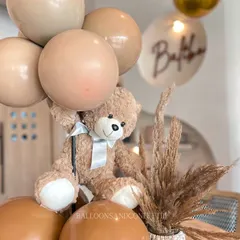 These adorable teddy bear table centerpieces are perfect for a baby shower. The neutral, earthy tones are great for a boho or teddy-bear-themed celebration.