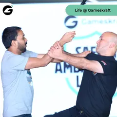 Here, I demonstrate a simple but effective wrist-lock technique to a Gameskraft employee. My methods are designed to be learned quickly and applied instinctively, regardless of a person's size or strength.