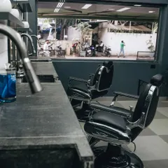 The view from the chair at Nomad Barber Mumbai. We designed the shop to be open and connected to the energy of the city.