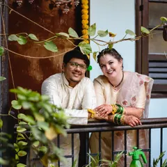 A lovely portrait of the couple in the courtyard of the wada. The mix of traditional architecture and lush greenery makes for a unique and beautiful photo location.