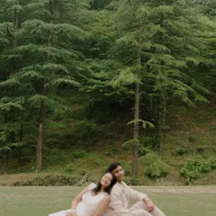 A peaceful picnic scene set against a backdrop of tall pine trees in Mussoorie. This image captures a quiet, intimate moment, perfect for couples who love nature and simplicity.