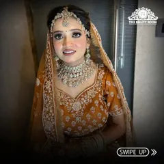 A closer look at this bride's joyful expression. The makeup is soft and glowing, with an emphasis on flawless skin and bright eyes.