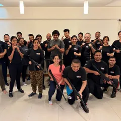 Our weapon defense modules are serious and practical. Here, participants from our 3.5-hour workshop learn defenses against assault rifle threats, a skill we teach to civilians and law enforcement alike.