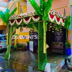 Another view of the traditional coconut leaf entrance, showing how it frames the doorway of a home. The fresh green leaves and flowers create a welcoming and festive feel for arriving guests.