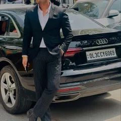 A confident stance next to my car. Success is a result of hard work and I believe in carrying myself with confidence.