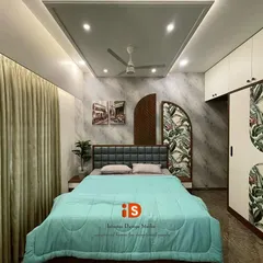 This "Go Green" themed guest bedroom combines nature-inspired elements with modern design. The room features a unique headboard with wood and tropical-print panels, a textured grey wall, and a sleek white sliding wardrobe that complements the theme.