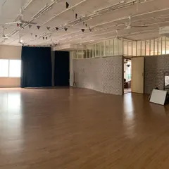 Our main dance studio, a spacious, light-filled room with wooden floors, ready for movement and creation. This is where the magic happens.