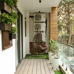 A complete project journey. From a cluttered, unused space (6), we created a stylish and functional long balcony (5, 8). The design features low-maintenance wooden decking, a cozy swing chair, and a dedicated seating nook with a vertical garden backdrop, completely transforming the vibe.