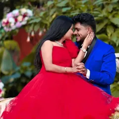 This is what a perfectly coordinated couple's photoshoot looks like. I offer matching rental outfits, like this stunning red gown and the sharp royal blue suit, so you can achieve a cohesive and romantic look without any hassle.