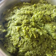 This is Jheengey aar Potoleyr khosha baataa, a paste made from the ground peels of ridge gourd and pointed gourd. It's a lip-smacking, rustic appetizer that honors the tradition of not wasting any part of the vegetable.