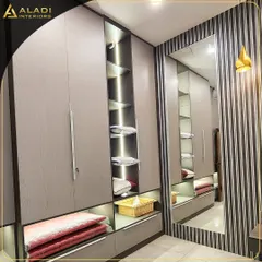 A sophisticated wardrobe with integrated open shelving featuring backlighting. The full-length mirror on the side enhances the room's sense of space while being highly practical.