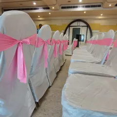 I provide chair rentals with covers and sashes in various colors to match your event's theme. Here, simple white chair covers are elevated with pretty pink bows for a baby shower.