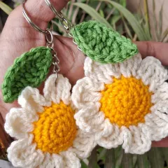 Our cheerful daisy crochet keychains. These small, handmade items are a symbol of strength and beauty, making them a perfect, meaningful gift to celebrate the women in your life.