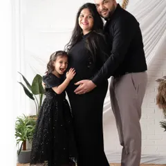 The whole family is waiting for you. Including older siblings in maternity shoots makes them feel special and captures the family's excitement as you prepare to welcome a new member.