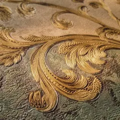 It's all in the details. This close-up reveals the exquisite texture and golden sheen of one of our premium classic designs. Our wallpapers add a layer of depth and luxury that paint simply cannot replicate.