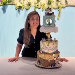 Me with the finished three-tier forest themed gravity cake. It’s so rewarding to see a complex vision come to life.