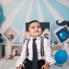 A classic portrait from the Boss Baby session. The simple, direct pose with the themed background creates a clean and charming photo that highlights his adorable expression.