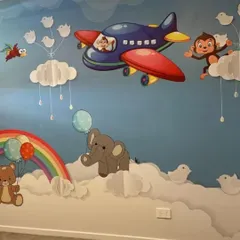 This whimsical sky-themed wallpaper is perfect for a nursery or playroom. It features cute animals like monkeys and elephants floating on clouds and in airplanes, creating a sweet and imaginative dreamscape for little ones.